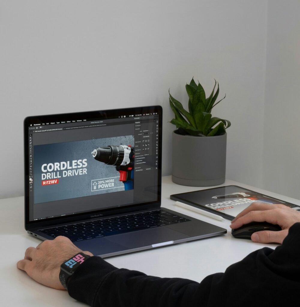 a person sitting at a desk with a laptop